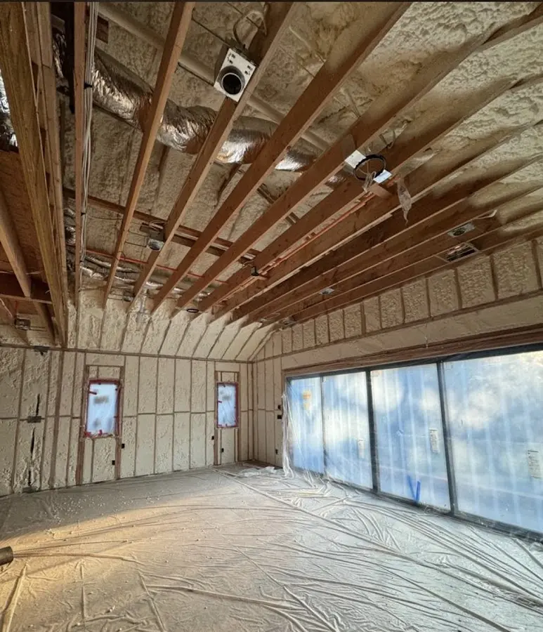 Interior walls and ceiling insulated with spray foam during new construction in Pittsfield